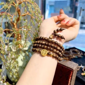 Vòng Tay Trầm Hương Tốc Thiên Nhiên Phối Charm Bánh Xe Pháp Luân - Thắng Giang