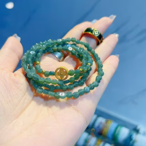 Vòng Tay Ngọc Lam Dẹt Thiên Nhiên Phối Bánh Xe Pháp Luân Bạc Ta Xi Vàng 24 Kara - Thắng Giang